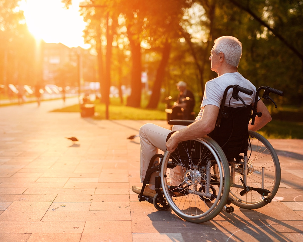 man outdoors in a wheelchair